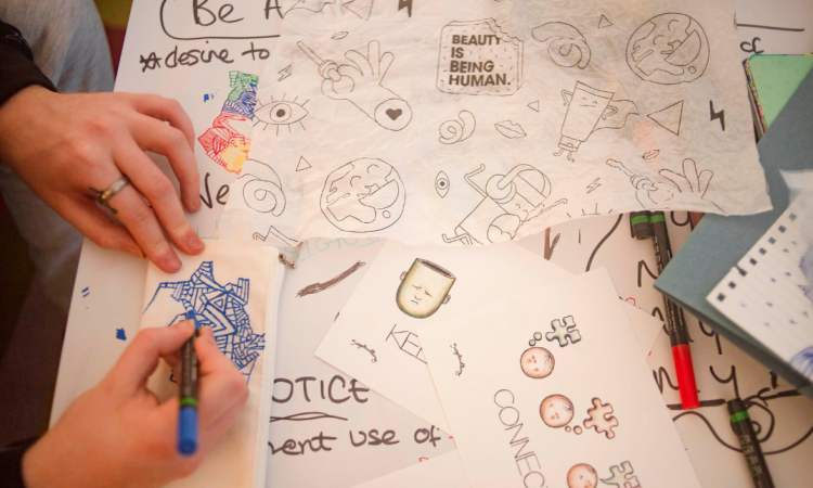 Paper with doodles and drawings
